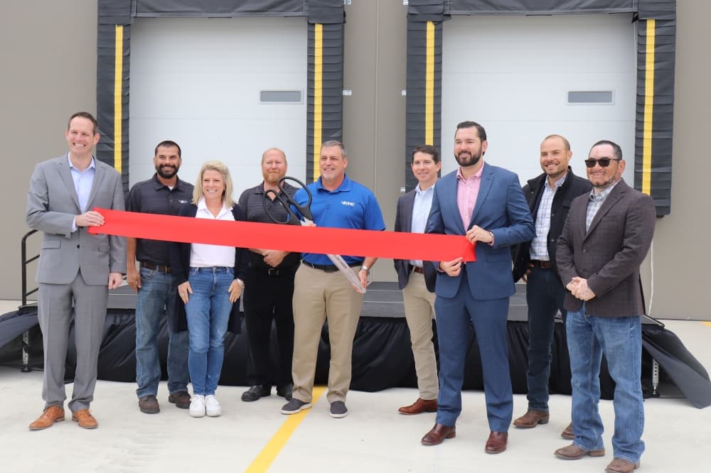 Viking SupplyNet officials commemorate coming to Kyle with a ribbon cutting. (Zara Flores/Community Impact Newspaper)