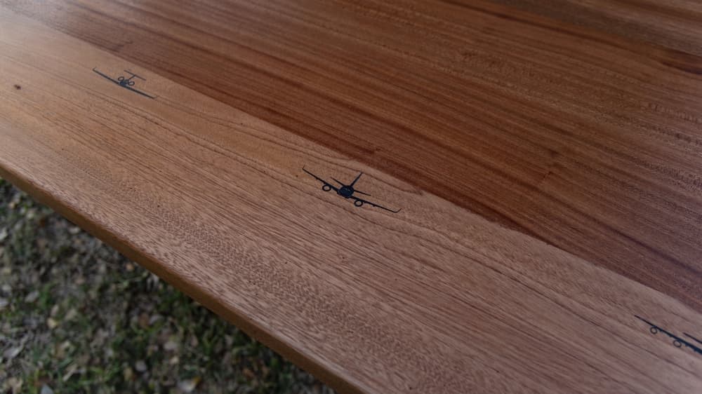 A close up of the military air crafts engraved on the mahogany table made for Lackland Air Force Base. (Courtesy of Robert Szabo)