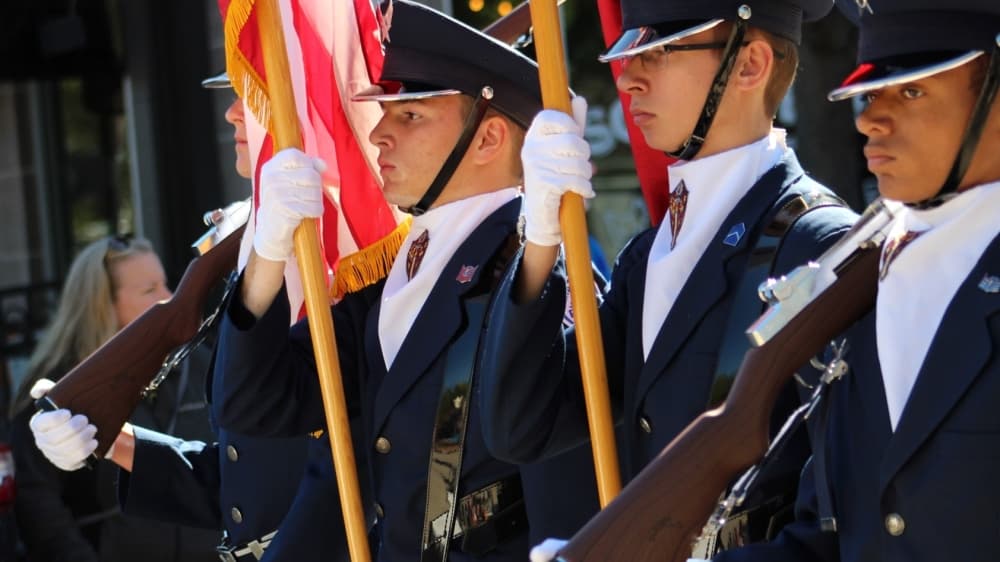 Members of the Air Force, Army and Marines walked with flags in the Oak Street parade. (Sandra Sadek/Community Impact Newspaper)