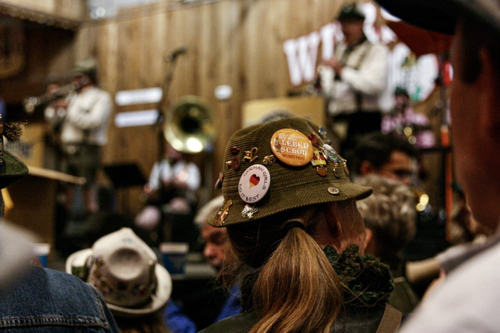 Many longtime visitors to Wurstfest don hats with commemorative pins. (Lauren Canterberry/Community Impact Newspaper)