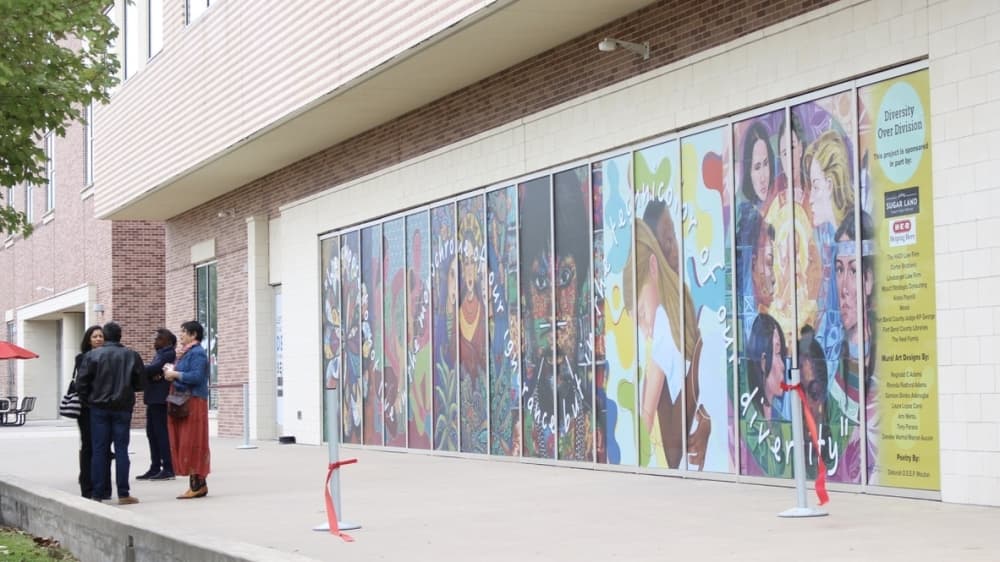The "Diversity over Division" mural is located on the east windows of the UH at Sugar Land's Brazos Hall. (Claire Shoop/Community Impact Newspaper)