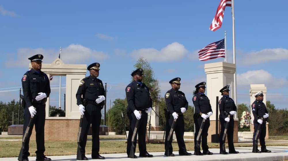The Missouri City Police Department Rifle Squad participated in a 21-gun salute during the ceremony. (Claire Shoop/Community Impact Newspaper) 
