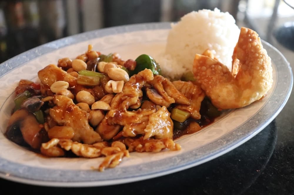 
Kung pao chicken with a side of steamed white rice or fried rice and an egg roll starts at $10.50 for dinner.