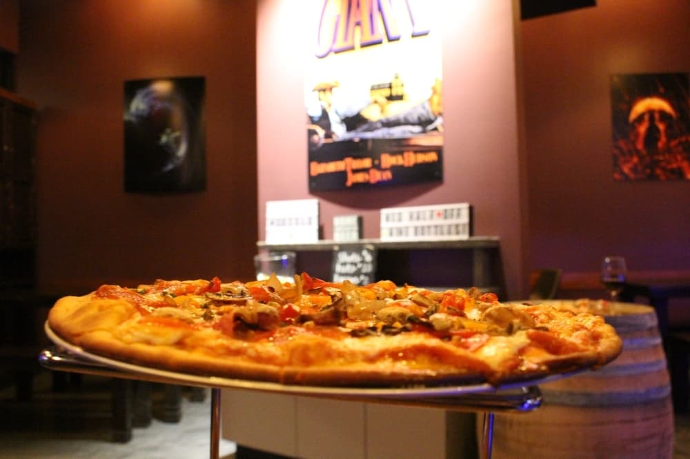 The Cosmic pizza ($18) is topped with pepperoni, prosciutto, marinated tomatoes, mushroom and onion. (Andrew Christman/Community Impact Newspaper)