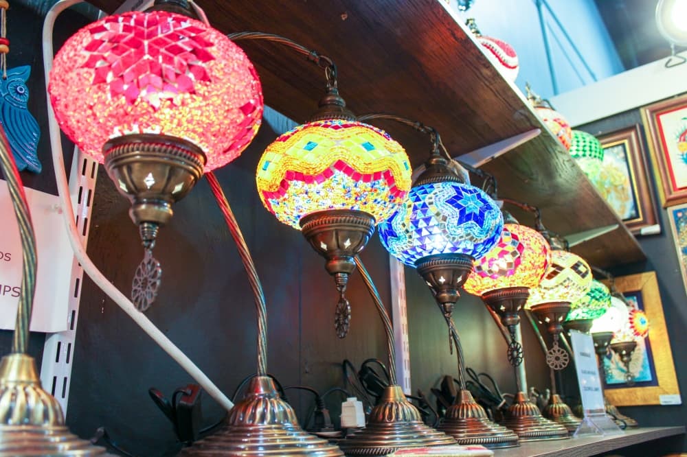 Local artisans sell everything from paintings to intricate lamps. (Hannah Zedaker/Community Impact Newspaper)