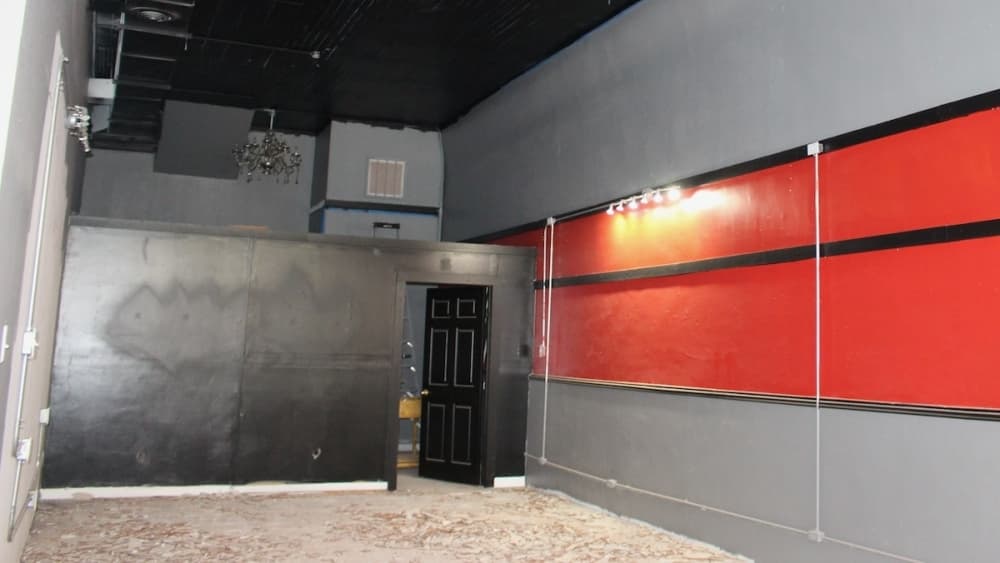 This space will house the expansion to Red Zeppelin Records with more retail space, and a bar area will eventually be placed against the far wall shown with the black paint. (Miranda Jaimes/Community Impact Newspaper)