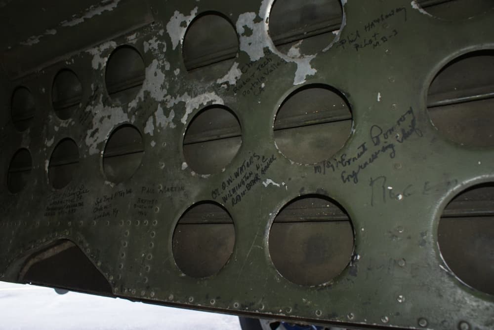 The bomb bay doors of the Devil Dog feature the signatures of dozens of soldiers who went to war in similar planes acquired as the plane tours the country at air shows and other special events. (Eddie Harbour/Community Impact Newspaper)