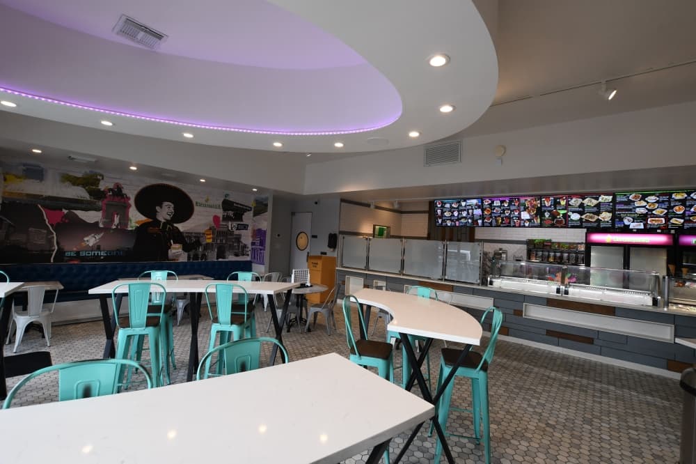 Refresqueria pulled in pop culture references and Rice University logos for the interior of its Rice Village shop. (Hunter Marrow/Community Impact Newspaper) 