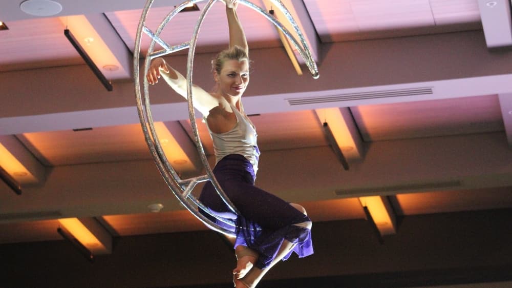 A performer suspended in the air entertained guests in the ballroom. (Sandra Sadek/Community Impact Newspaper)