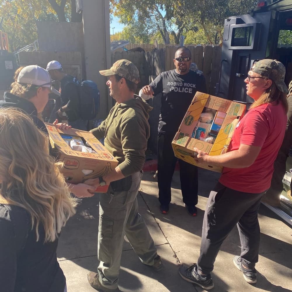 Volunteers help distribute food at the Round Rock Area Serving Center's "Hike for Hunger" event. (Courtesy Round Rock Area Serving Center) 
