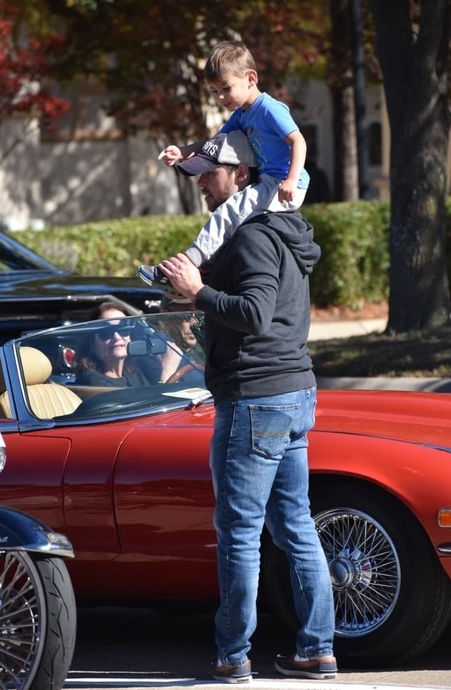 Kyle Lester and his son, Logan, look around at the Colleyville Fall Car Show on Nov. 13. (Anjali Krishna/Community Impact Newspaper)