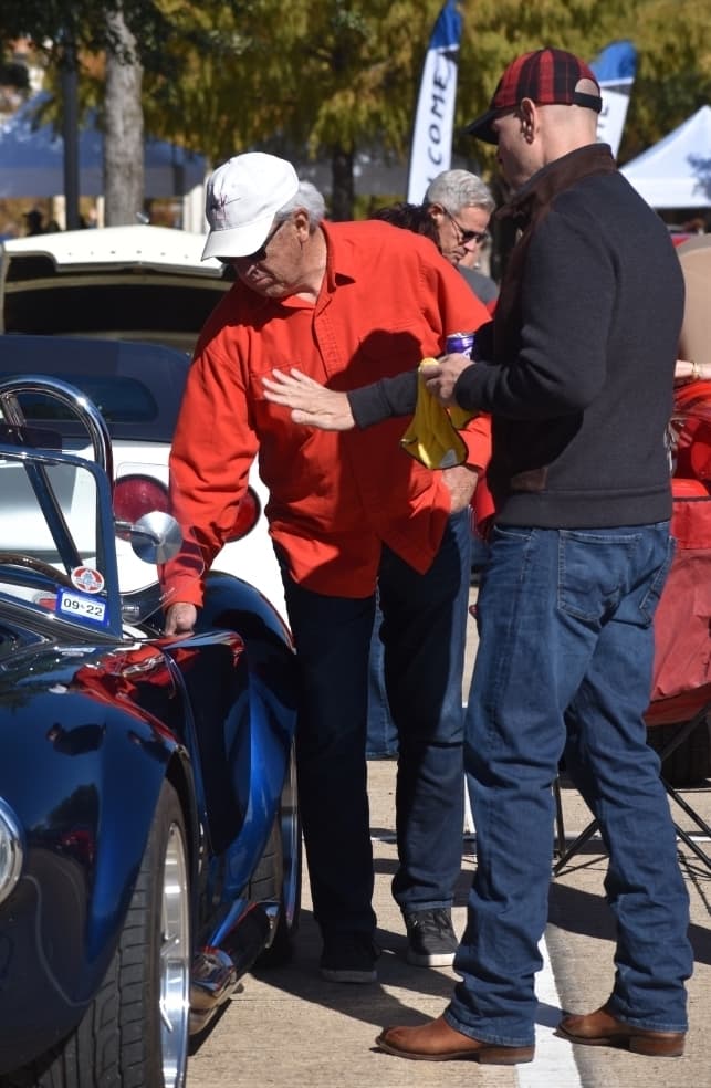 Larry Johnson shows off his car at the Colleyville Fall Car Show on Nov. 13 at Colleyville City Hall. (Anjali Krishna/Community Impact Newspaper)