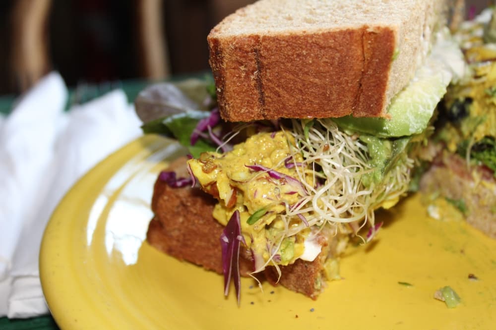 The Dwalin sandwich ($17.99): A curry chicken salad is made with grapes, almonds, lettuce, tomato and mayo. Avocado and sprouts can also be added. (Sierra Rozen/Community Impact Newspaper)