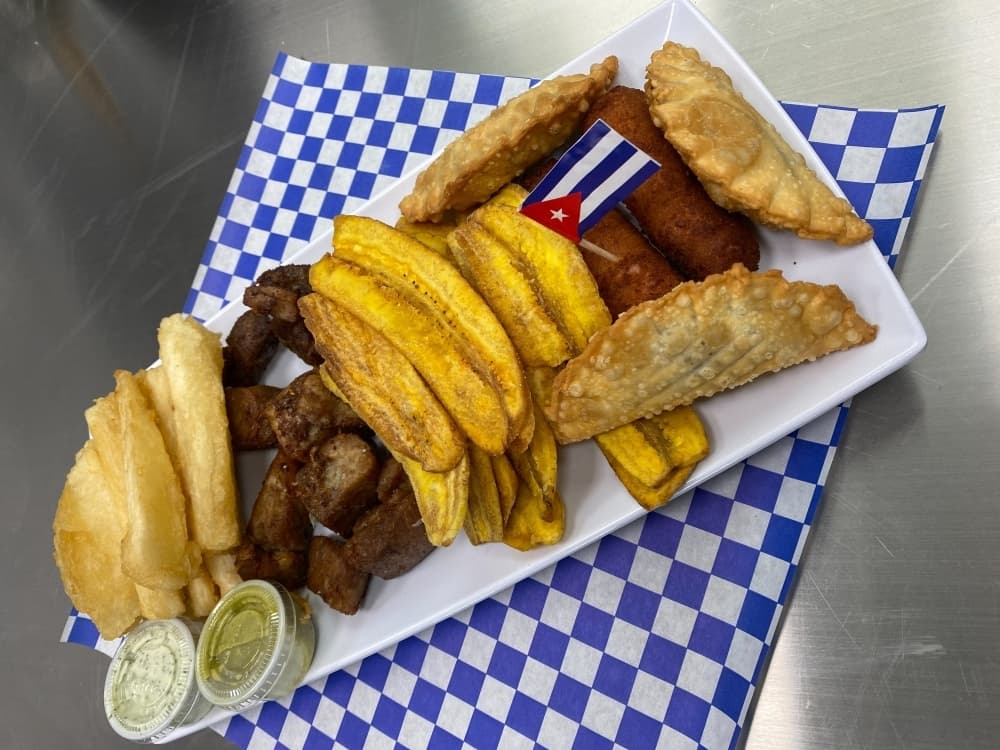 Cuban sampler ($17) is served with masitas, plantains, mini empanadas, croquetas and pork. (Courtesy Yamilka Cortina)
