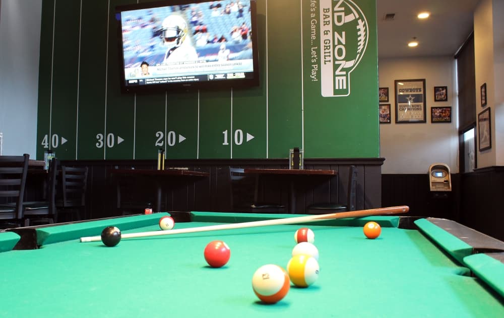 In addition to eating and drinking, End Zone customers enjoy meeting one another, watching sports, playing billiards and darts and singing Karaoke, Kelly said. (Karen Chaney/Community Impact Newspaper)