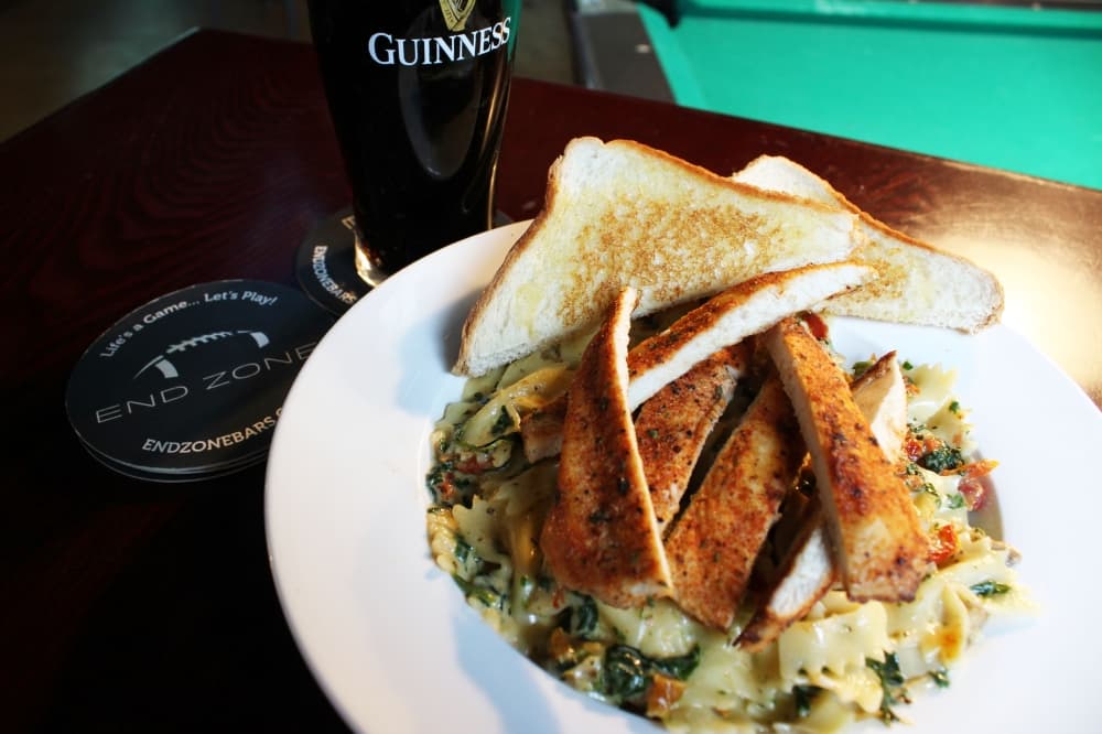 Chicken Florentine ($13.00) features bowtie pasta in a creamy parmesan sauce with mushrooms, spinach, and sundried tomatoes. It's topped with sliced Italian chicken breast and served with Texas Toast. (Karen Chaney/Community Impact Newspaper)