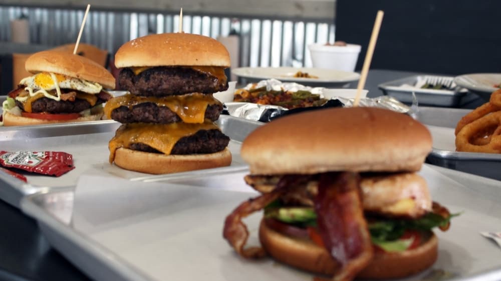three burgers at JC's burger, including the Toddzilla