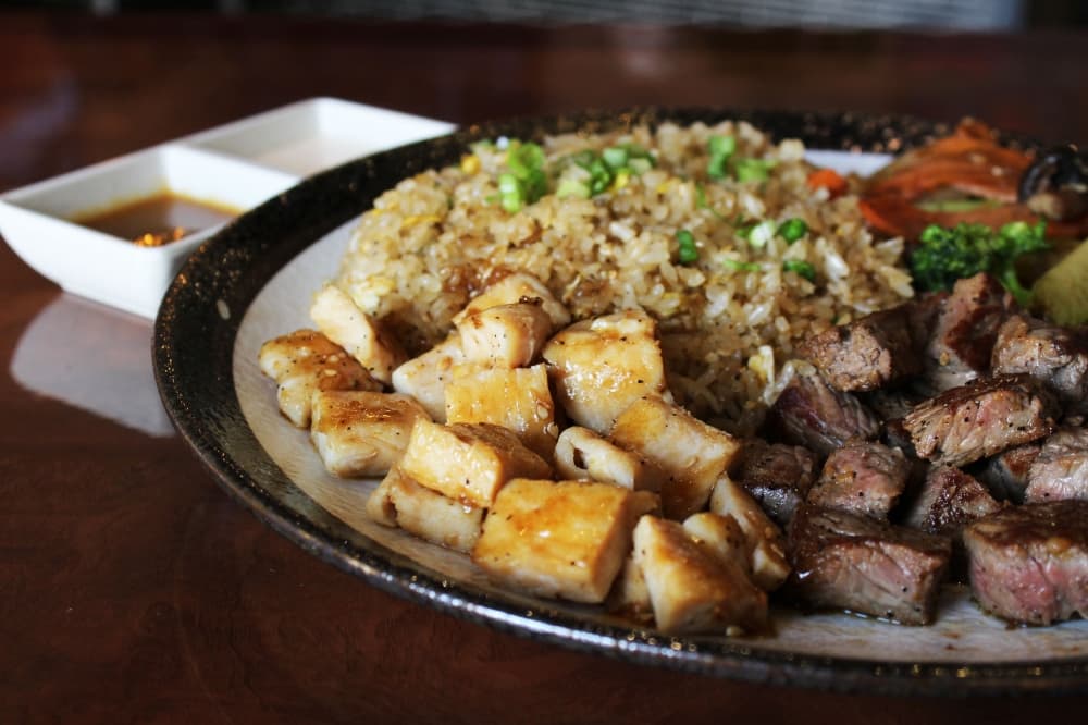 Hibachi Combination Steak & Chicken (lunch $18.95, dinner $27.95) is served with several sides. (Karen Chaney/Community Impact Newspaper)