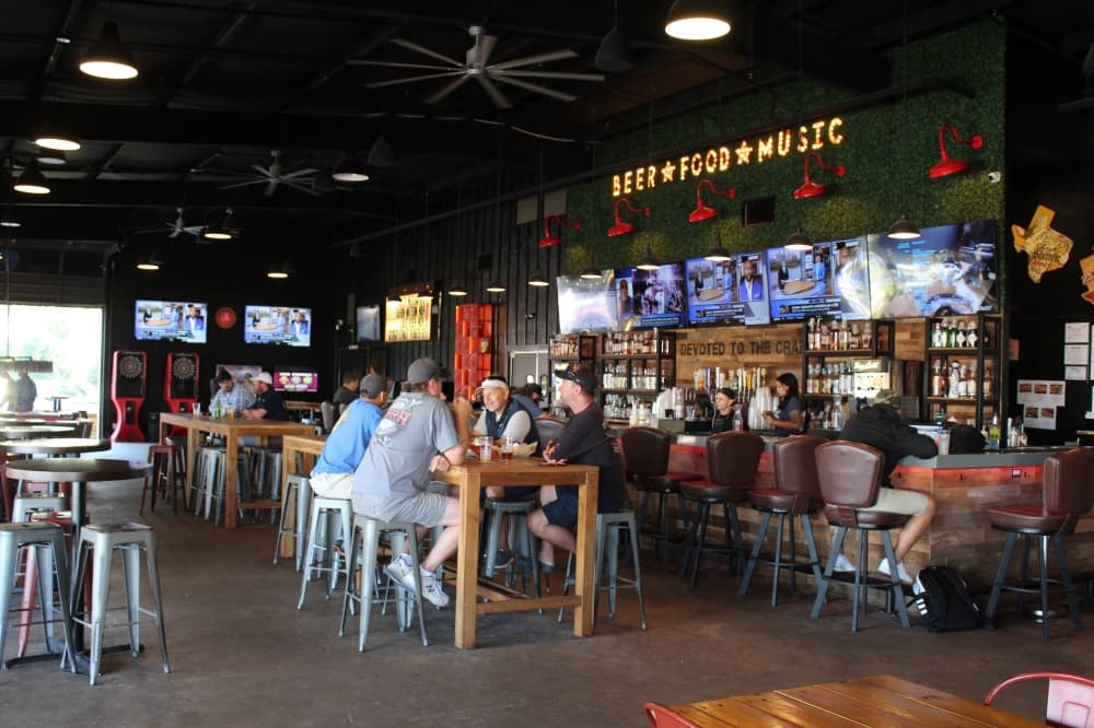 
Sawyer Park Icehouse has a variety of indoor amenities, including a bar, decorative walls and bar games such as pool. 