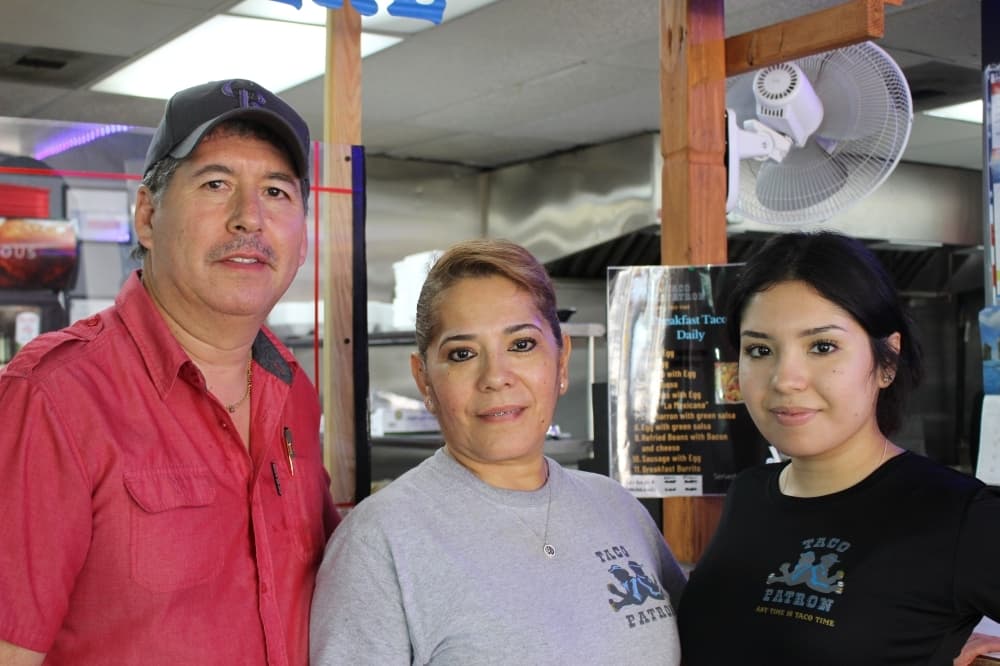 Gilbert (left) and Alma Perez (center) started Taco Patron with their son and two of their daughters, including Jessica (right), in February 2020. (Chandler France/Community Impact)