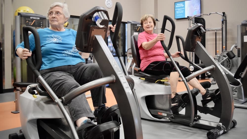 From left to right, Joyce Kerby and Donna Ray exercise at the McKinney Senior Recreation Center. (Matt Payne/Community Impact Newspaper)