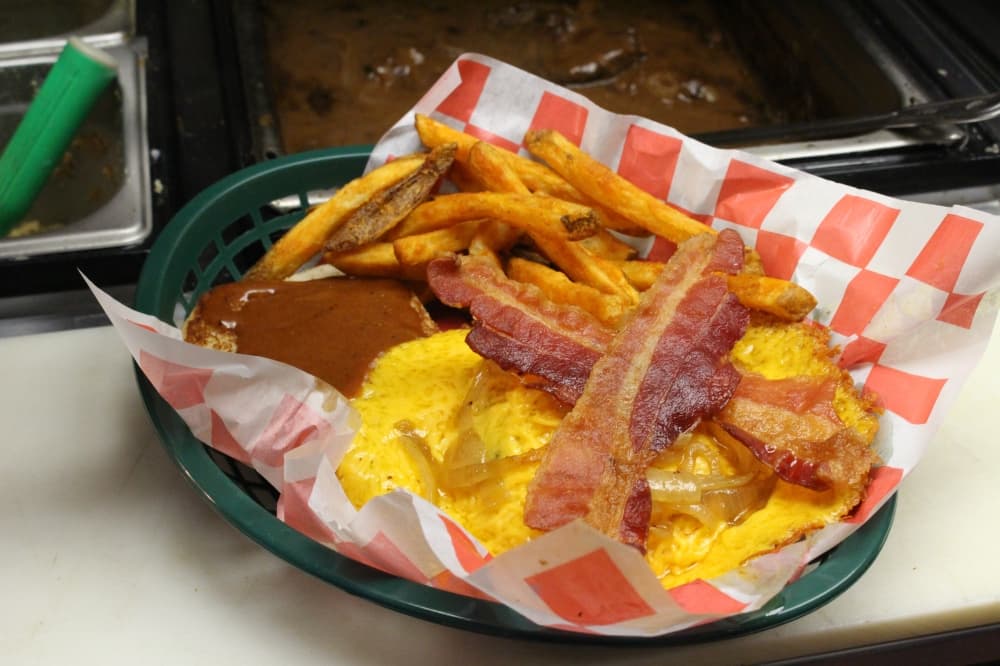 The Magnolia Burger ($12.95) comes with cheese, bacon, grilled onions and a sweet and spicy sauce. (Chandler France/Community Impact Newspaper)