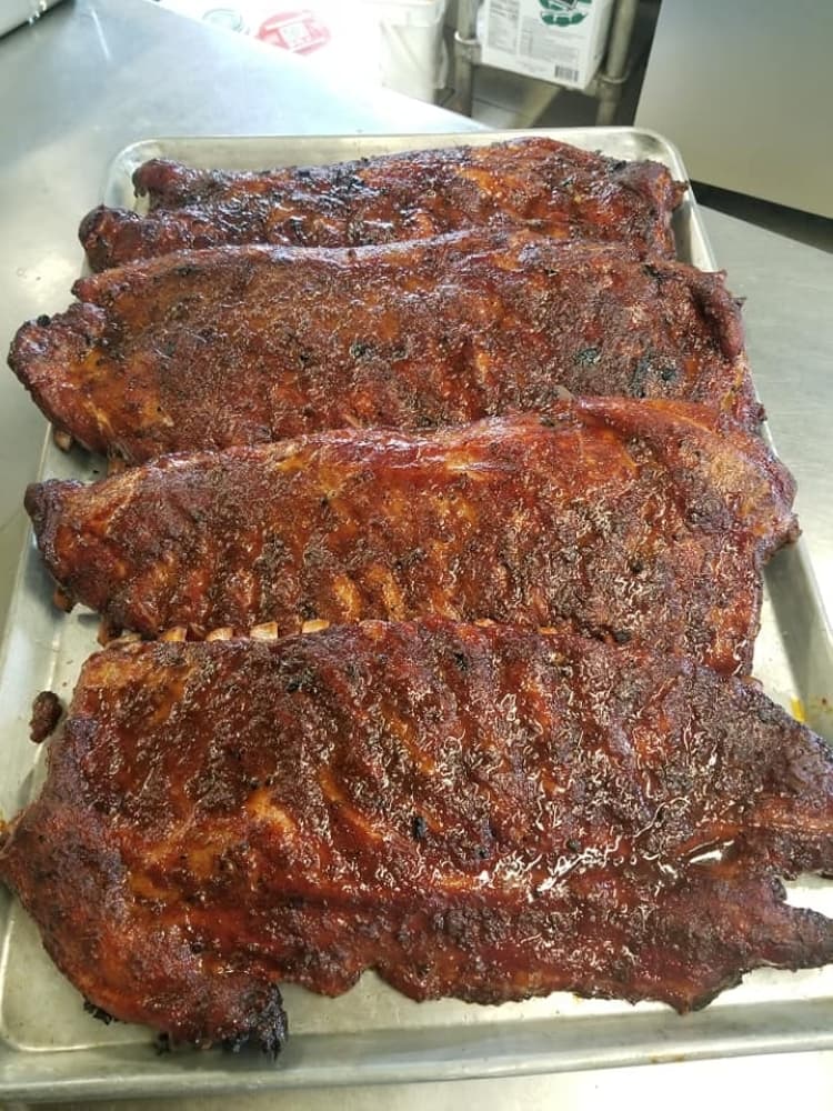 Carl’s serves ribs by the rack or per pound. A ribs plate costs $14.95, while a pound costs $17.25. (Jishnu Nair/Community Impact Newspaper)