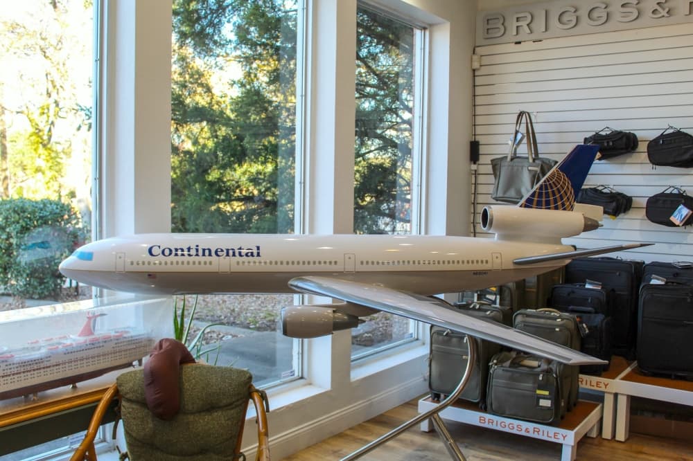 Steve Cosgrove got a call last year asking whether he wanted a large DC-10 Continental Airlines model airplane from a travel agency in Houston that was closing. It now sits on display at the front window of Dynamic Travel & Cruises, which Cosgrove owns. (Photos by Bailey Lewis/Community Impact Newspaper)