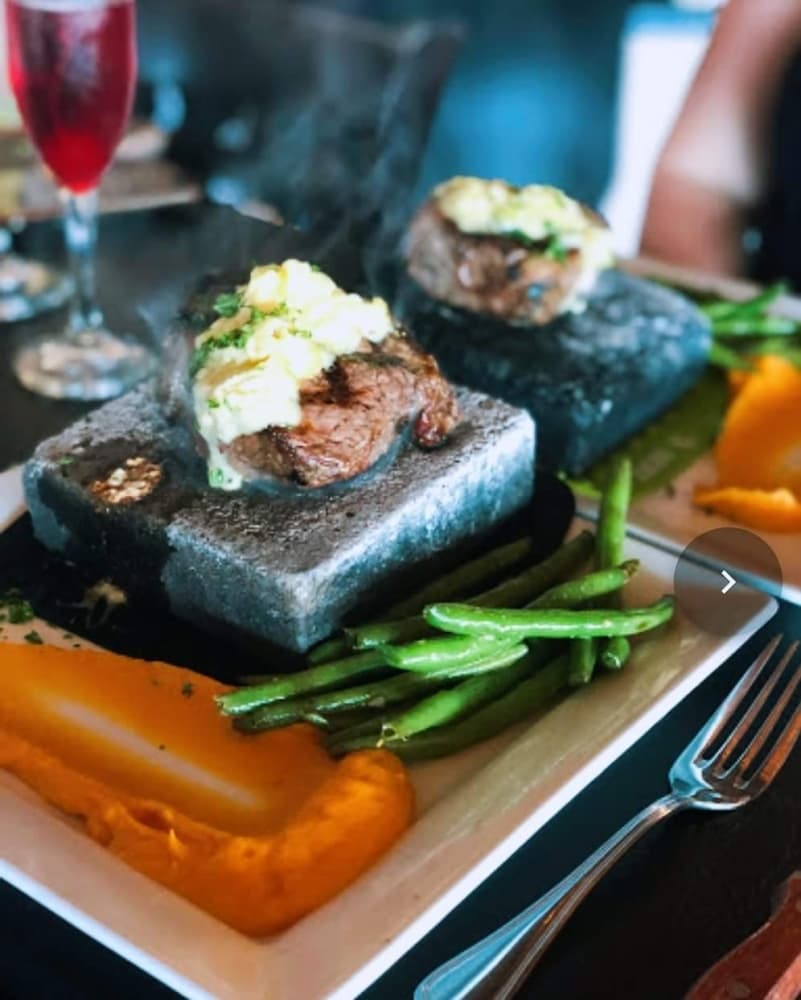 Salt Block Filet Mignon:
Drizzled with rich bearnaise sauce and served on a sizzling himalayan salt block, the steak remains hot while eaten.
