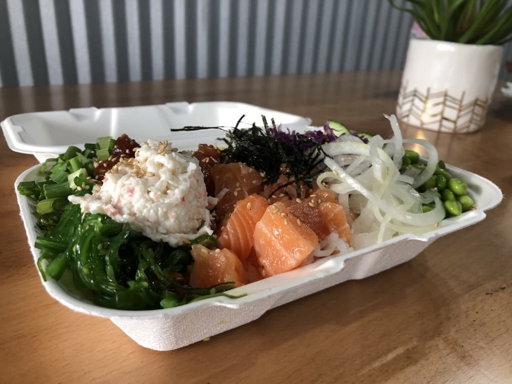 Customers can build their own poke bowls with a variety of seafood and other toppings. (Grace Dickens/Community Impact Newspaper)