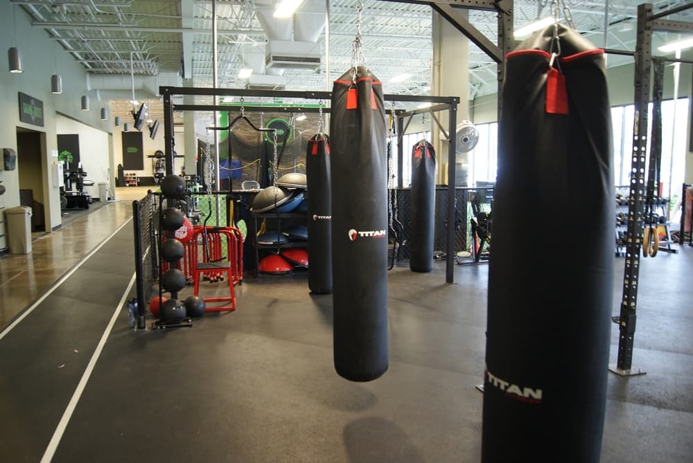 There are rows of punching bags at FACT Fitness in Georgetown. (Eddie Harbour/Community Impact Newspaper)