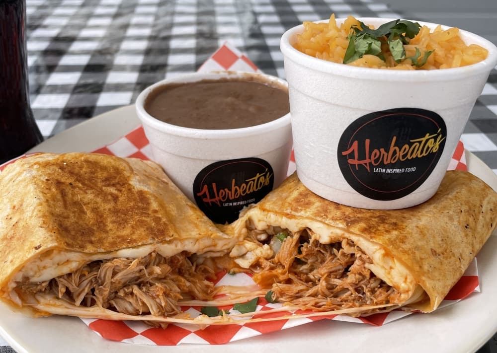 Zinga Tinga Quesadillas ($12): Served with rice and beans, this dish consists of marinated shredded chicken, Oaxaca cheese, onions and cilantro. (Courtesy Herbeato's Latin Inspired Food)