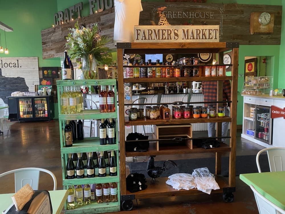 Snow also stocks locally owned hot sauces, wines and other items in a new retail shelf on the dining room floor. (Brooke Sjoberg/Community Impact Newspaper)