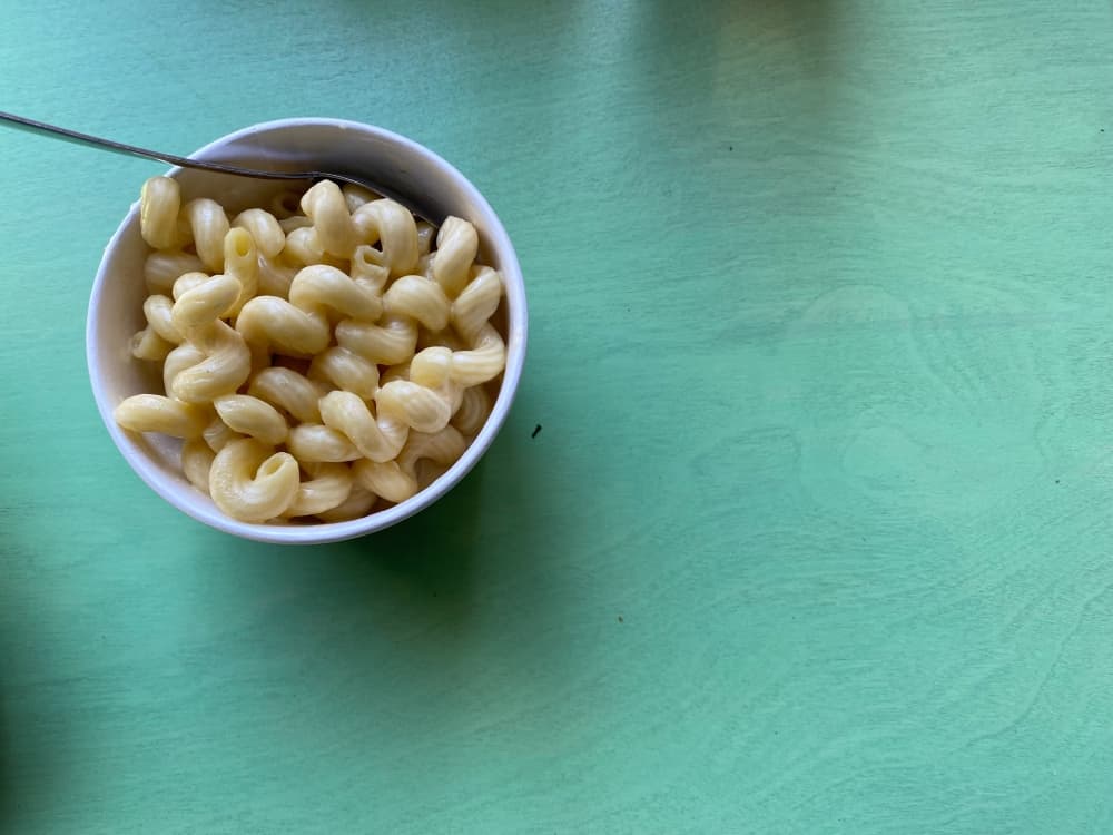 Greenhouse's macaroni and cheese can be topped with green chile and bacon or grilled chicken and avocado, based on preference. (Brooke Sjoberg/Community Impact Newspaper)