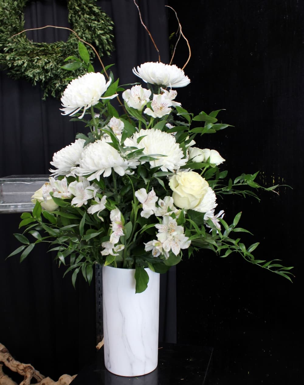 This arrangement is often used for condolences ($95). (Karen Chaney/Community Impact Newspaper)