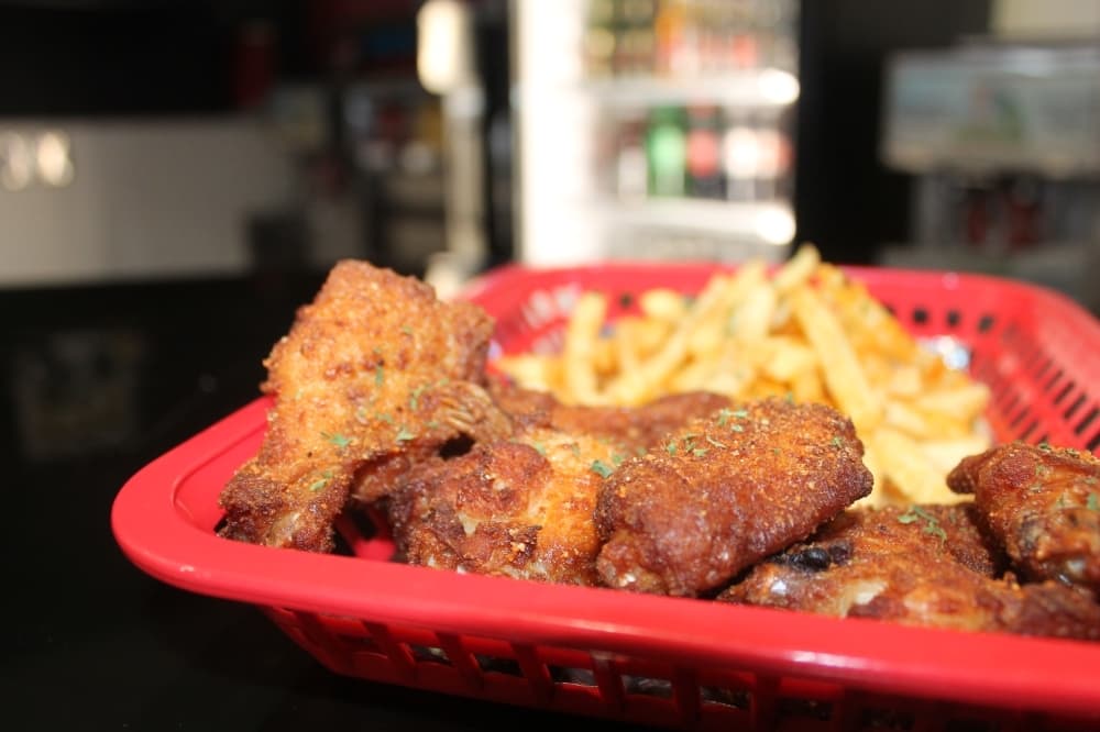Spice Buddy wings ($12.50) are served with either hot or original flavorings. (Sierra Rozen/Community Impact Newspaper)