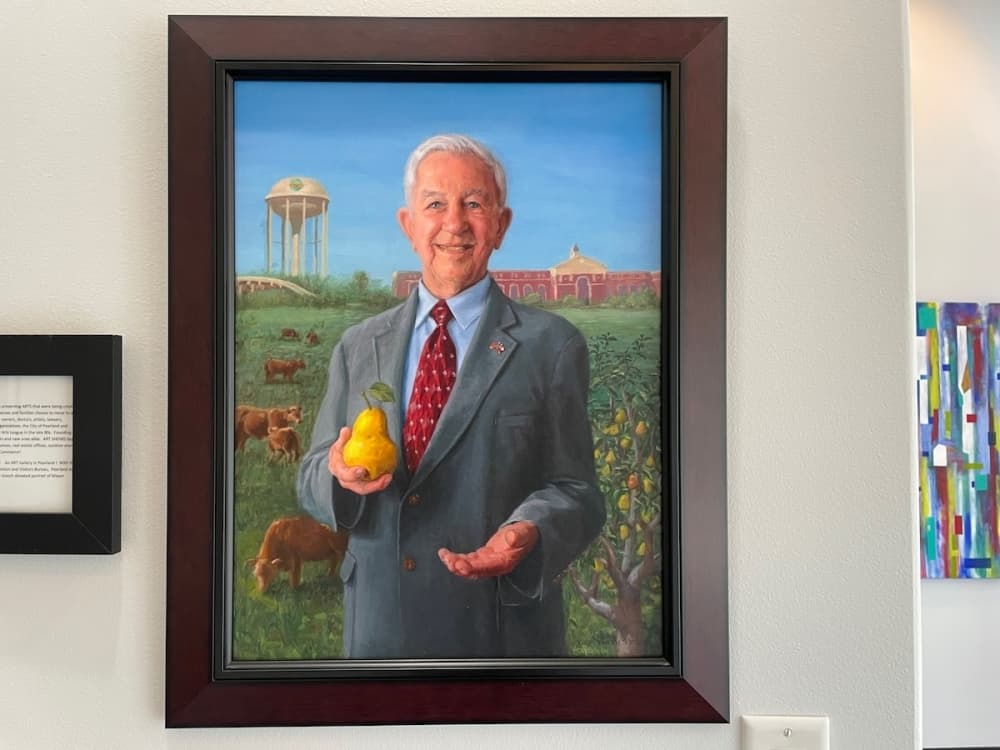 Former Pearland Mayor Tom Reid, who helped create the first meetings that led to the establishment of the Pearland Arts League. Painting was made by Vicky Gooch. (Andy Yanez/Community Impact Newspaper)