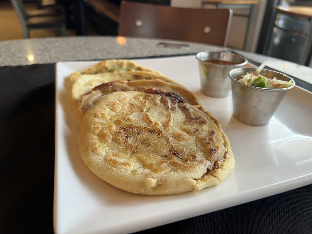 Pupusas are filled with cheese and refried beans, spinach, pork or garlic. ($9) (Grace Dickens/Community Impact Newspaper)