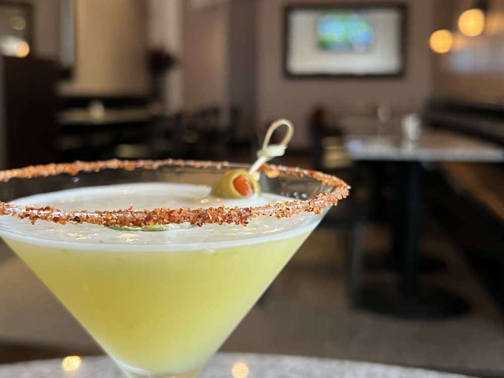 The Spicy Mexican Martini with fresh muddled jalapenos is one of the bar’s most popular drinks. ($9) (Grace Dickens/Community Impact Newspaper)
