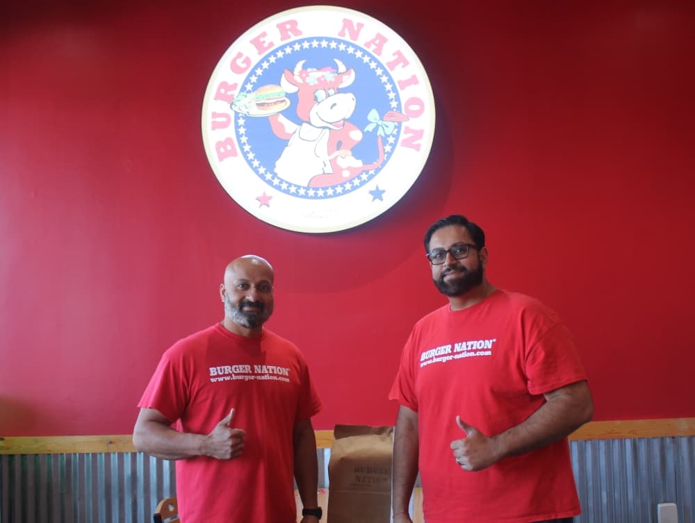Tony (left) and Mike Mistry opened their first Burger Nation location in Victoria in 2011. (Colleen Ferguson/Community Impact Newspaper)