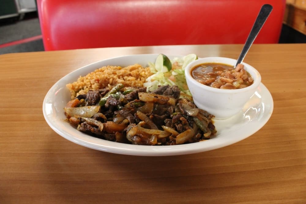 Bistec ranchero: A beef fajita plate is served with grilled onions, tomato, jalapenos and charro beans. ($11.99)