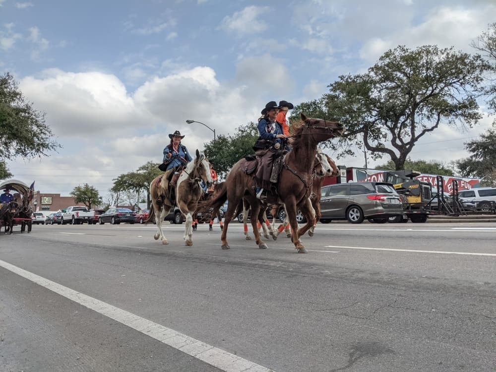 Trail riders paraded along Main Street on Feb. 22 after leaving the Tomball Historic Depot Plaza for an overnight stay at Spring Creek Park. (Anna Lotz/Community Impact Newspaper)