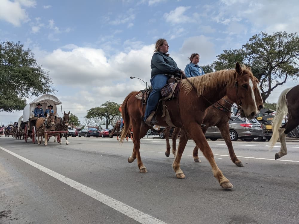Trail riders paraded along Main Street on Feb. 22 after leaving the Tomball Historic Depot Plaza for an overnight stay at Spring Creek Park. (Anna Lotz/Community Impact Newspaper)