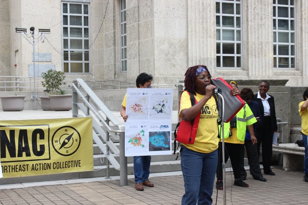 Sandra Edwards wore a life jacket to depict the struggles she and many others face in her community. (Sofia Gonzalez/Community Impact Newspaper)