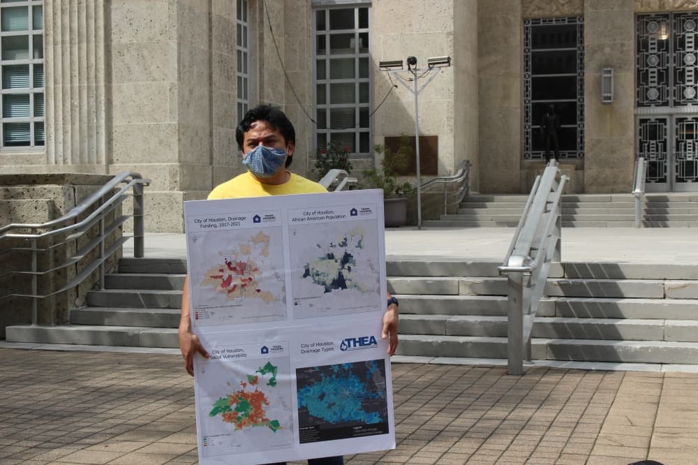 The protestors held visuals to support their arguments of drainage inequity around Houston. (Sofia Gonzalez/Community Impact Newspaper)