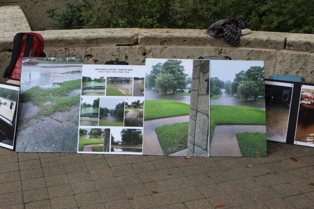 The protestors came together to create posters showing what their communities experience during each rainfall. (Sofia Gonzalez/Community Impact Newspaper)
