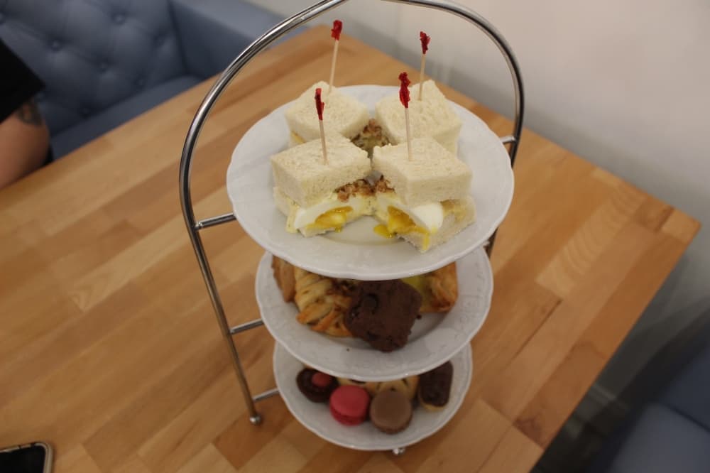 The Garden Set ($49.95) comes with assorted pastries, a pot of tea, a sandwich and a slice of cake. (Sierra Rozen/Community Impact Newspaper)