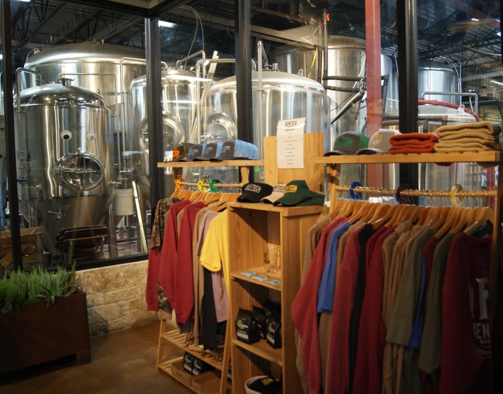 The Rentsch Tap Room also sells branded merchandise from the brewery and its sister brand, Strange Land Brewery. (Eddie Harbour/Community Impact Newspaper) 