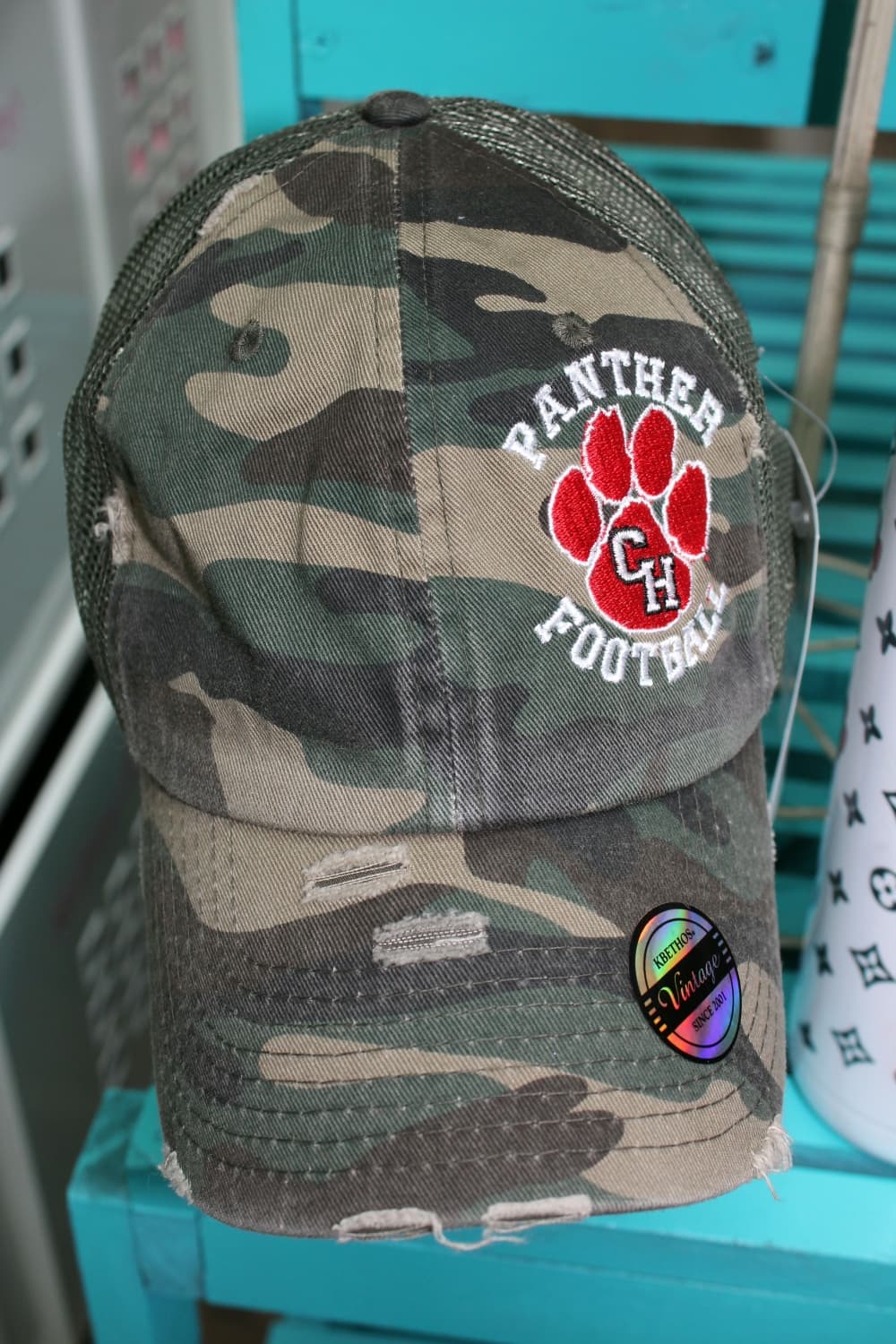 Many Bling It! Boutique customers order school spirit wear. Embroidery caps range from $22-$28. (Karen Chaney/Community Impact Newspaper)