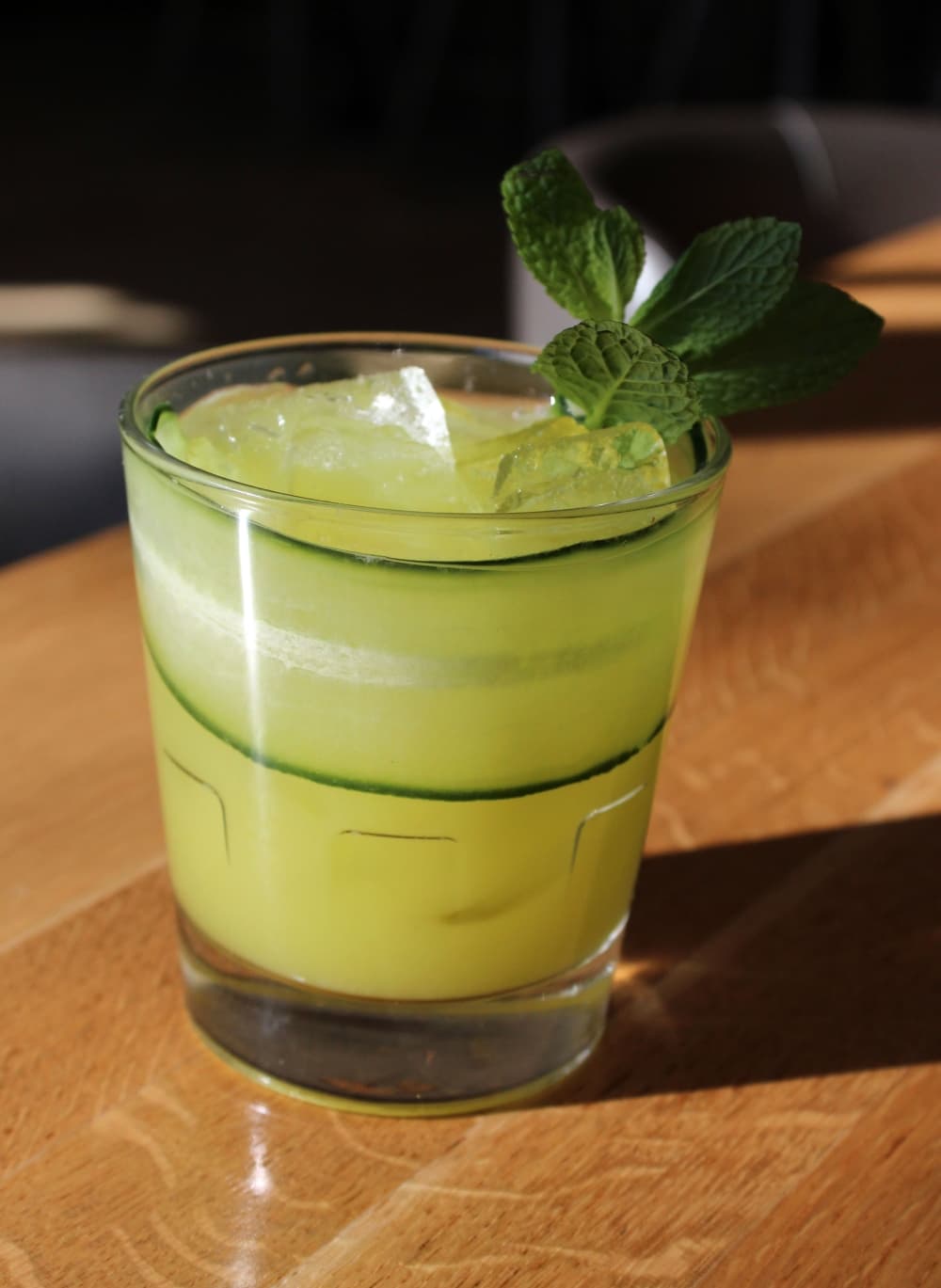 Cucumber Cobbler ($13) consists of Tito’s Handmade Vodka, Midori, lime, Tyku cucumber sake, Liber & Co. ginger, and mint. (Karen Chaney/Community Impact Newspaper)